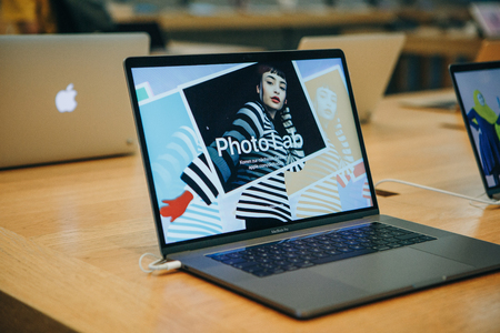 Berlin, August 29, 2018: Retail sale of new MacBooks in the official store of Apple in Berlin. Modern and stylish laptops.のeditorial素材