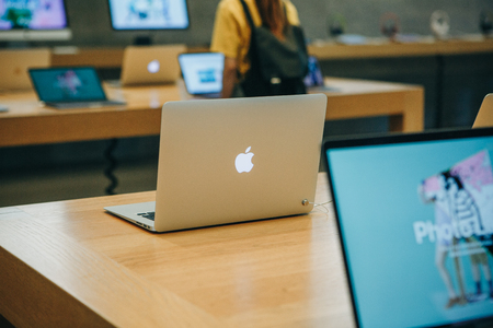 Berlin, August 29, 2018: Retail sale of new MacBooks in the official store of Apple in Berlin. Modern and stylish laptops.のeditorial素材