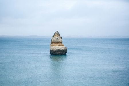 Minimalistic view of the rock in the middle of the Atlantic Ocean. Amazing natural landscape.の写真素材