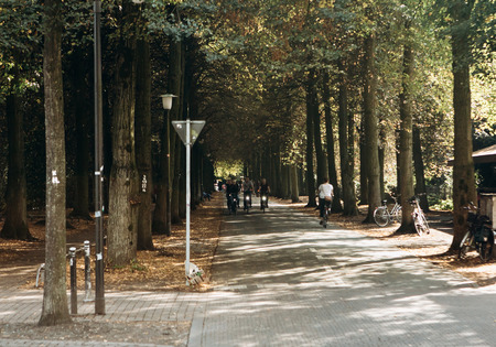 Germany, Muenster, October 5, 2018: People ride bicycles along the bike path. Everyday city lifeのeditorial素材