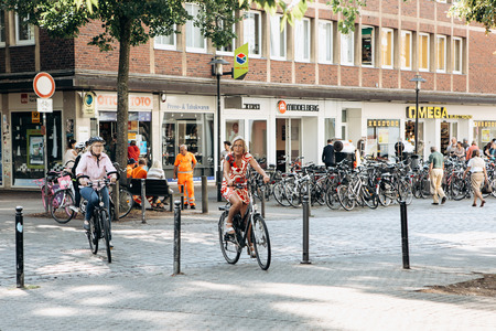 Germany, Muenster, October 5, 2018: People ride bicycles along the bike path. Everyday city lifeのeditorial素材