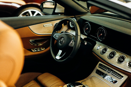 Berlin, August 29, 2018: Inside the new Mercedes-Benz car. Close-up steering wheel and dashboard. Modern German car.のeditorial素材
