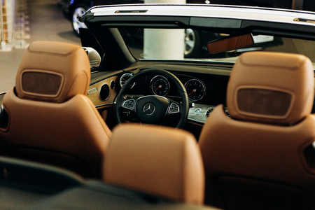 Berlin, August 29, 2018: Inside the new Mercedes-Benz car. Close-up steering wheel and dashboard. Modern German car.のeditorial素材