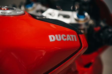 Berlin, August 29, 2018: Close-up. Emblem of Dukati on a sport red motorcycle. The world-famous Italian company producing sports motorcycles.のeditorial素材