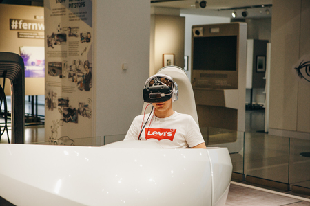Berlin, August 29, 2018: Virtual driving with the help of virtual glasses of the new concept car Volkswagen I.D. Virtual driving the car of the future at the exhibition DRIVE Volkswagen Group Forum.のeditorial素材