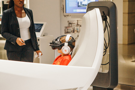 Berlin, August 29, 2018: Virtual driving with the help of virtual glasses of the new concept car Volkswagen I.D. Virtual driving the car of the future at the exhibition DRIVE Volkswagen Group Forum.のeditorial素材