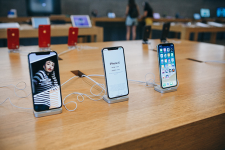 Berlin, August 29, 2018: New iPhone X stand in a row and sold in the official Apple Store in Berlin.のeditorial素材