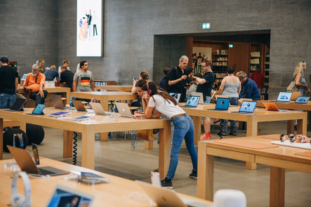Berlin, August 29, 2018: Sale of Apple products in the official Apple Store in Berlin. People will choose modern gadgets for shopping for themselves and for gifts.のeditorial素材