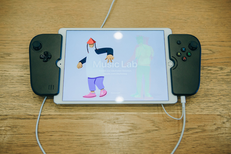Berlin, August 29, 2018: Tablet ipad with special joysticks which turns into a console.のeditorial素材