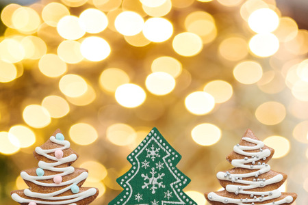 Christmas or New Year background. Christmas trees on a golden background.