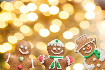 Christmas or New Year background. Ginger snowman and ginger men on a golden background.