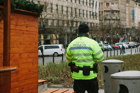 Prague, December 25, 2017: A police officer patrols public order while celebrating Christmas.のeditorial素材