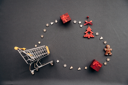 Conceptual photo of Christmas sales or gift shopping. Preparing for the New Year and Christmas. Buying gifts.の写真素材