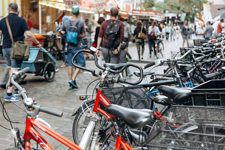 Germany, Muenster, September 25, 2018: A lot of bikes are packed in the street. Popular and environmentally friendly transport in Europe.のeditorial素材