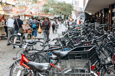 Germany, Muenster, September 25, 2018: A lot of bikes are packed in the street. Popular and environmentally friendly transport in Europe.のeditorial素材