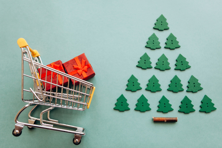 Conceptual photo of Christmas sales or gift shopping. Preparing for the New Year and Christmas. Buying gifts.の写真素材