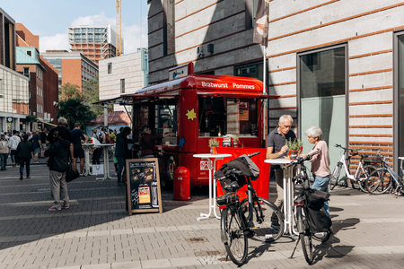 Germany, Muenster, October 5 2018: Sale of street food with a truck equipped for trade. Small business at the city fair.のeditorial素材