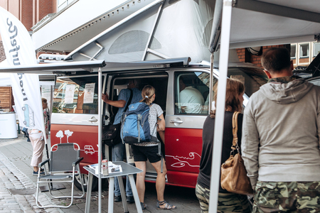 Germany, Muenster, October 5 2018: Sale of street food with a truck equipped for trade. Small business at the city fair.のeditorial素材