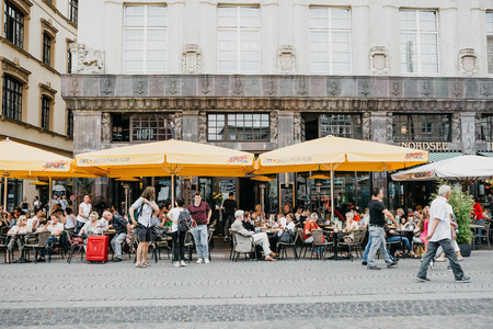 Germany, Leipzig, October 6, 2018: Street Cafe. People eat drink and communicate with each otherのeditorial素材