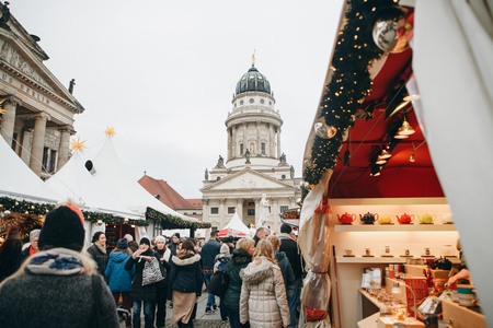 Berlin, December 25, 2017: People choose Christmas gifts at the traditional decorated Christmas market in Berlin, Germany.のeditorial素材