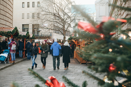 Berlin, December 25, 2017: People choose Christmas gifts at the traditional decorated Christmas market in Berlin, Germany.のeditorial素材
