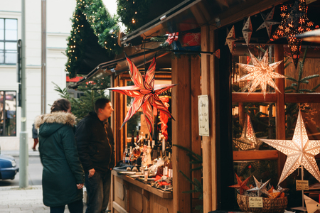 Berlin, December 25, 2017: People choose Christmas gifts at the traditional decorated Christmas market in Berlin, Germany.のeditorial素材