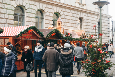 Berlin, December 25, 2017: People choose Christmas gifts at the traditional decorated Christmas market in Berlin, Germany.のeditorial素材