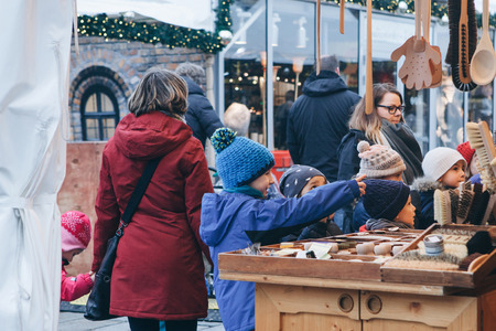 Berlin, December 25, 2017: Children choose Christmas gifts at the traditional decorated Christmas market in Berlin, Germany.のeditorial素材