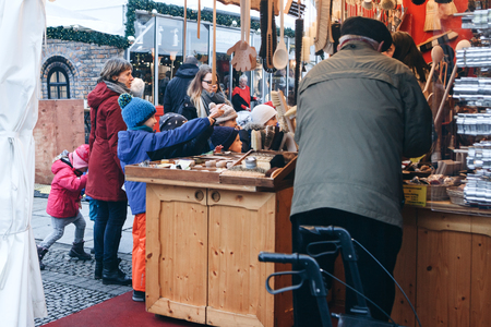 Berlin, December 25, 2017: People choose Christmas gifts at the traditional decorated Christmas market in Berlin, Germany.のeditorial素材