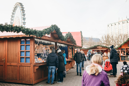 Berlin, December 25, 2017: People choose Christmas gifts at the traditional decorated Christmas market in Berlin, Germany.のeditorial素材