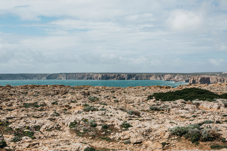 Beautiful view of the Atlantic Ocean and coastal cliffs off the coast of Portugal on a sunny day.の写真素材