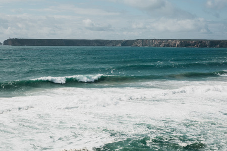 Beautiful view of the Atlantic Ocean and coastal cliffs off the coast of Portugal on a sunny day.の写真素材