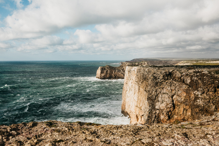 Beautiful view of the Atlantic Ocean and coastal cliffs off the coast of Portugal on a sunny day.の写真素材