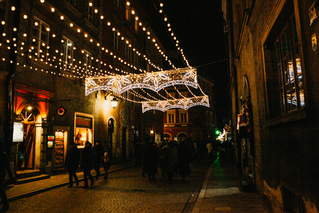 Warsaw, December 31, 2017: Street night decorations on the streets at Christmas in Warsaw in Poland. Christmas celebration in Europe.のeditorial素材