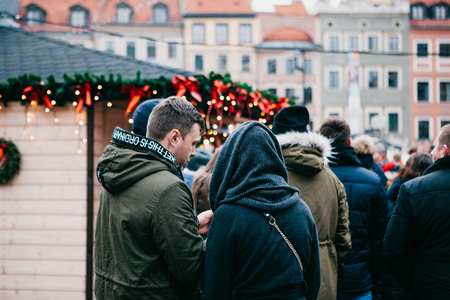 Warsaw, December 25, 2017: People choose Christmas gifts or fast food at the traditional decorated Christmas market.のeditorial素材