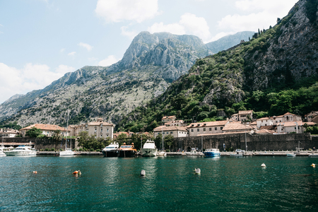Beautiful view of the Adriatic Sea, mountains, buildings and ships in the Bay of Kotor in...