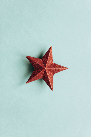 Christmas or New Year concept in a minimal style - a Christmas decoration in the form of a star. Minimalism.の写真素材
