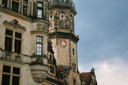 Part of the ancient architectural complex called the Royal Palace in Dresden in Germany gainst the backdrop of the setting sun in the evening. This complex of buildings was built in the 16th century.の写真素材