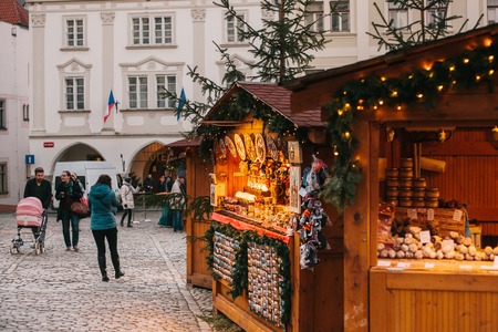 Czech Republic, Cesky Krumlov, December 25, 2017: City Christmas Market. Stall decorated in the Christmas style. People buy gifts and food.のeditorial素材
