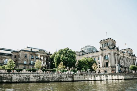 Beautiful view of the Reichstag building on a sunny summer day. One of the attractions of Berlin in Germany and a favorite place to visit tourists.の写真素材
