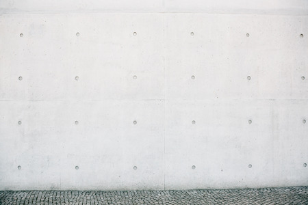 Empty concrete white or gray outer wall and sidewalk.の写真素材