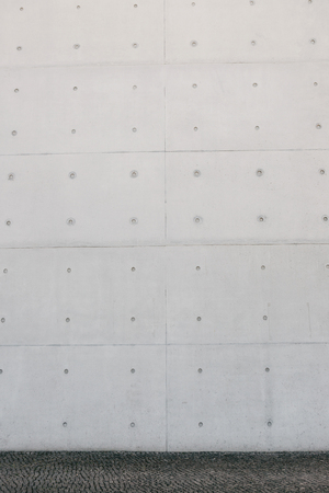 Empty concrete white or gray outer wall and sidewalk.