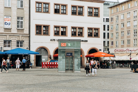 Germany, Leipzig, October 6, 2018: Town Square in Leipzig. Everyday life. People walk through the pedestrian zone. Near shops and cafes. In the center of the elevator for descending down the subwayのeditorial素材