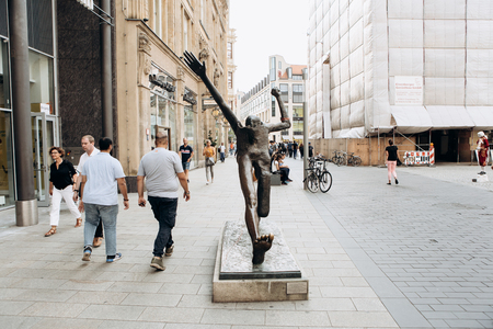 Germany, Leipzig, September 6, 2018: The statue is called Step of the Century on the street of Leipzig.のeditorial素材