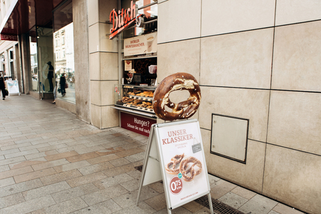 Germany, Leipzig, September 6, 2018: Selling a traditional German pretzel on a city streetのeditorial素材