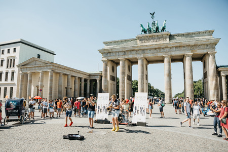 Germany, Berlin, September 05, 2018: A group called Blowing Doozy plays jazz on the square next to the Brandenburg Gate. A musical performance for tourists and locals.のeditorial素材