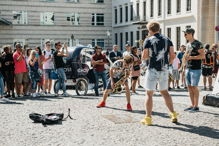 Germany, Berlin, September 05, 2018: A group called Blowing Doozy plays jazz on the square next to the Brandenburg Gate. A musical performance for tourists and locals.のeditorial素材