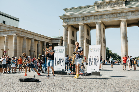 Germany, Berlin, September 05, 2018: A group called Blowing Doozy plays jazz on the square next to the Brandenburg Gate. A musical performance for tourists and locals.のeditorial素材