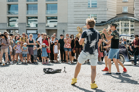 Germany, Berlin, September 05, 2018: A group called Blowing Doozy plays jazz on the square next to the Brandenburg Gate. A musical performance for tourists and locals.のeditorial素材
