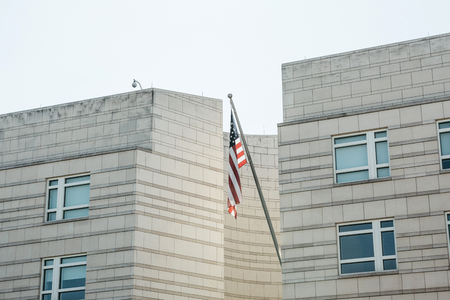American flag on the building of the Embassy of America in Berlin in Germany.の写真素材